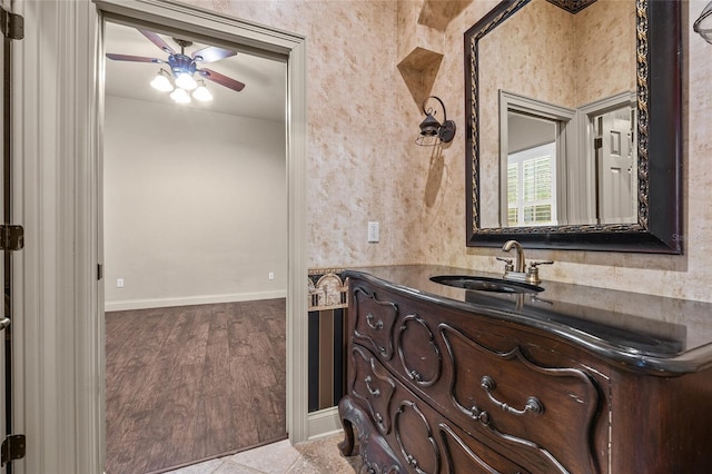 bathroom with ceiling fan, tile patterned floors, and vanity