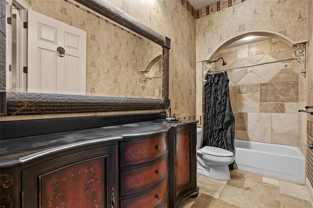 full bathroom featuring toilet, shower / tub combo, and vanity