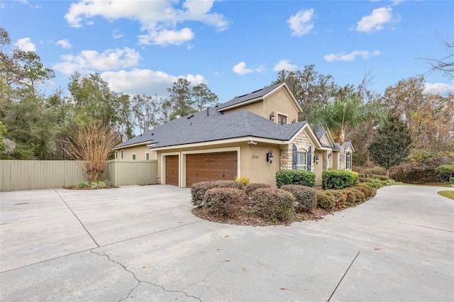 view of property exterior with a garage