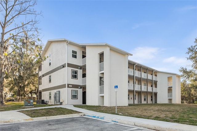 view of building exterior featuring central AC