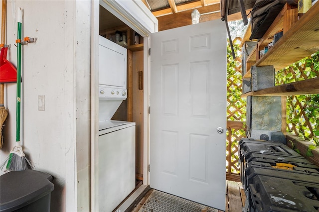 washroom with stacked washer and dryer