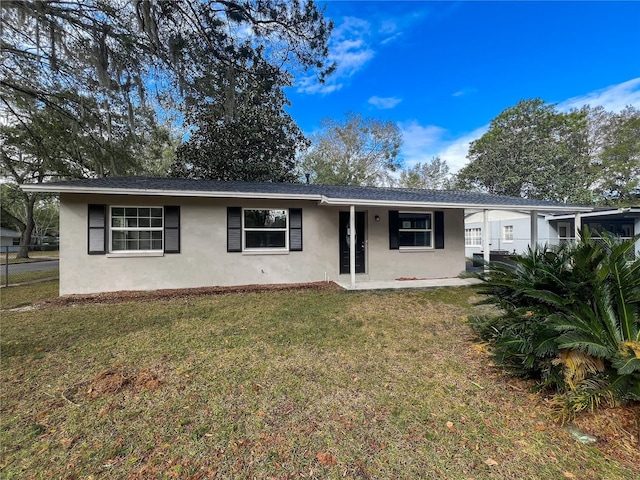 single story home featuring a front yard