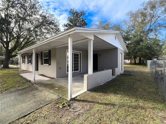 view of side of home featuring a yard