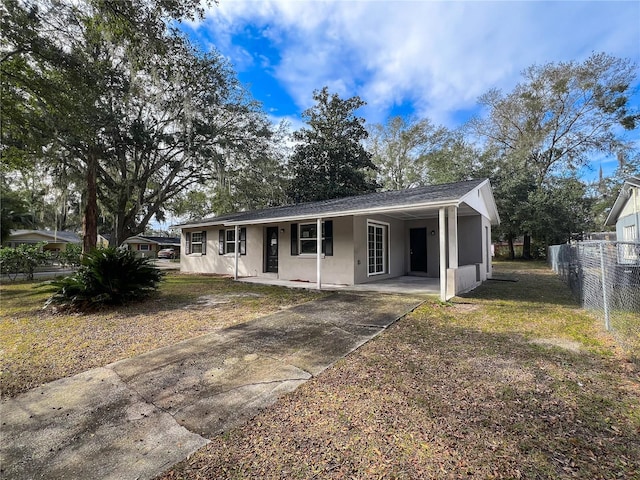 ranch-style home with a carport