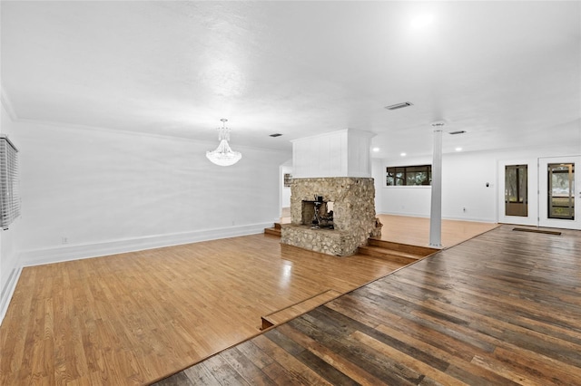 unfurnished living room with a fireplace and light wood-type flooring