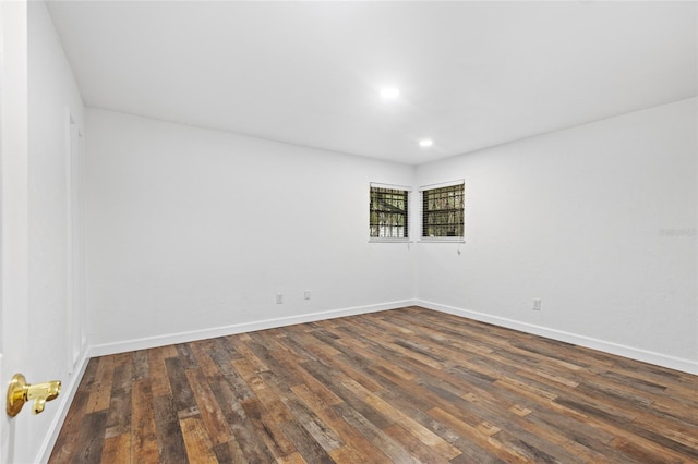 unfurnished room featuring dark wood-type flooring