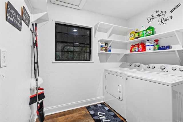 washroom with washing machine and clothes dryer and dark hardwood / wood-style flooring