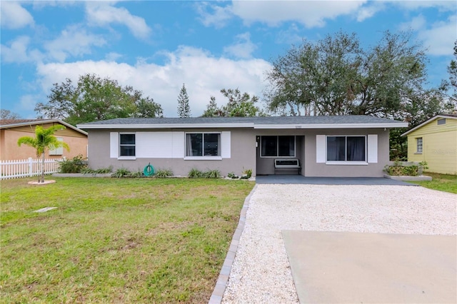 ranch-style house featuring a front lawn