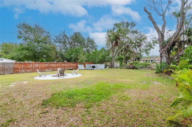 view of yard with an outdoor fire pit