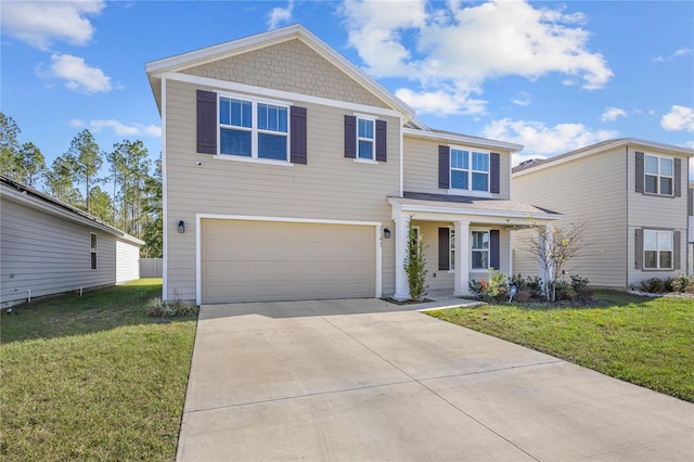 view of front of property with a garage and a front lawn