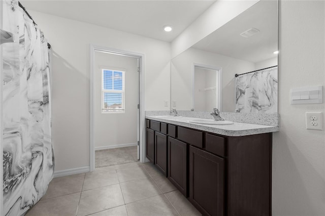 bathroom with vanity and tile patterned flooring