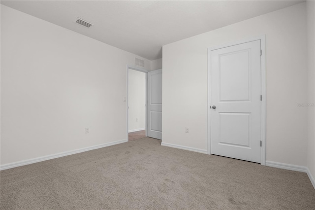 unfurnished bedroom with light carpet