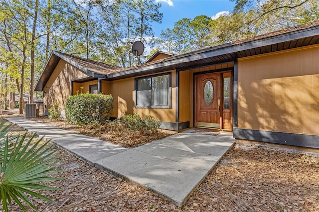 entrance to property featuring central AC unit