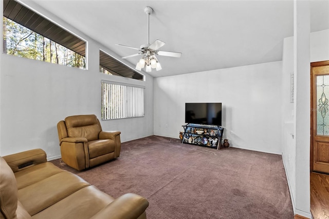 living room featuring high vaulted ceiling, ceiling fan, and carpet