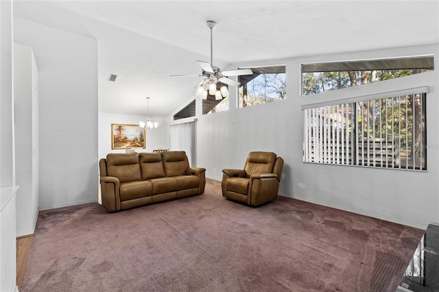 living room with ceiling fan with notable chandelier, vaulted ceiling, and carpet flooring