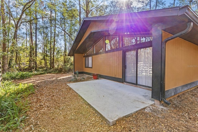 view of home's exterior with a patio area