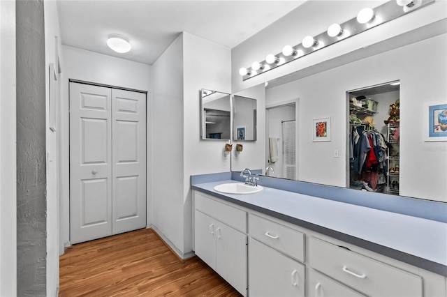 bathroom featuring hardwood / wood-style flooring and vanity