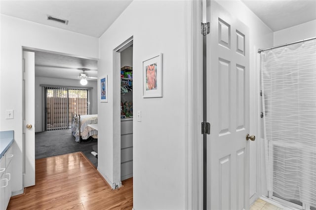 hallway with light wood-type flooring