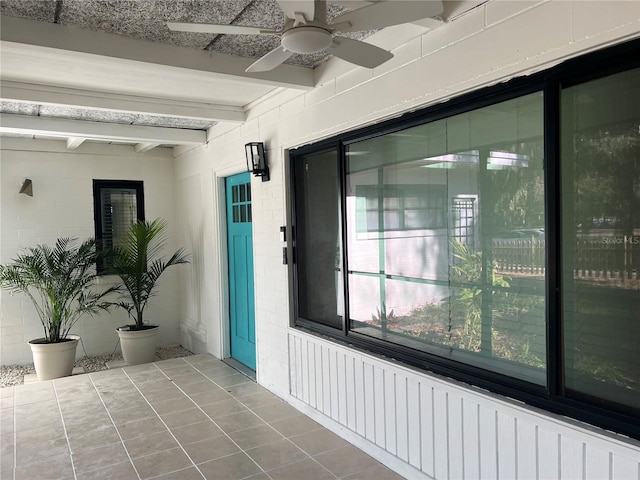 property entrance featuring ceiling fan