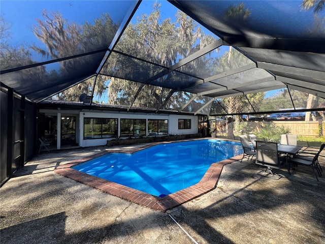 view of pool featuring a patio area and glass enclosure