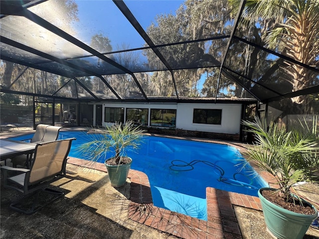 view of pool with a lanai and a patio