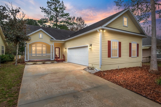 view of front facade featuring a garage and covered porch