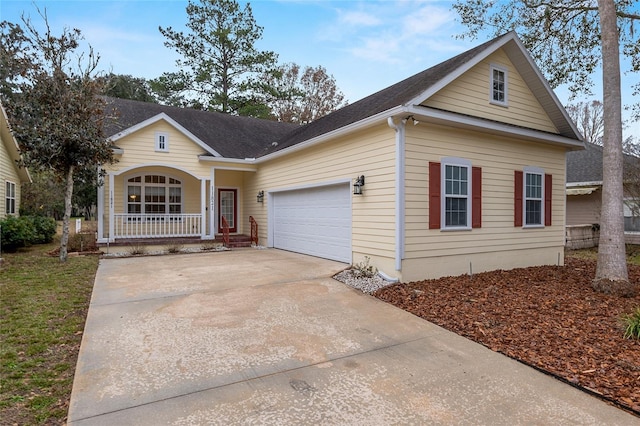 view of front of home with a porch and a garage