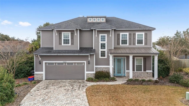 view of front facade featuring a garage and a front lawn