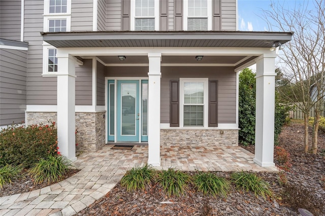 property entrance with covered porch