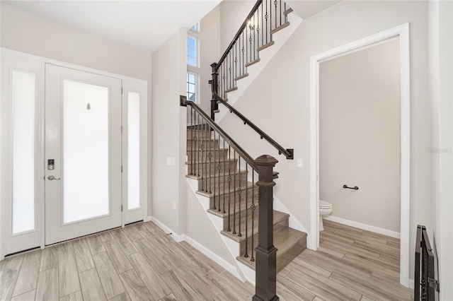 foyer entrance featuring heating unit