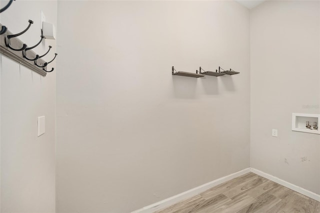 washroom with washer hookup and light wood-type flooring