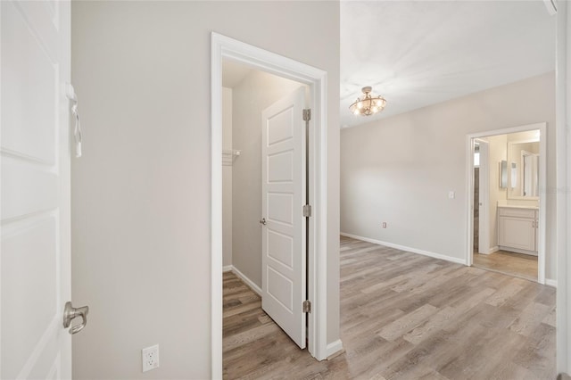 hallway with light wood-type flooring