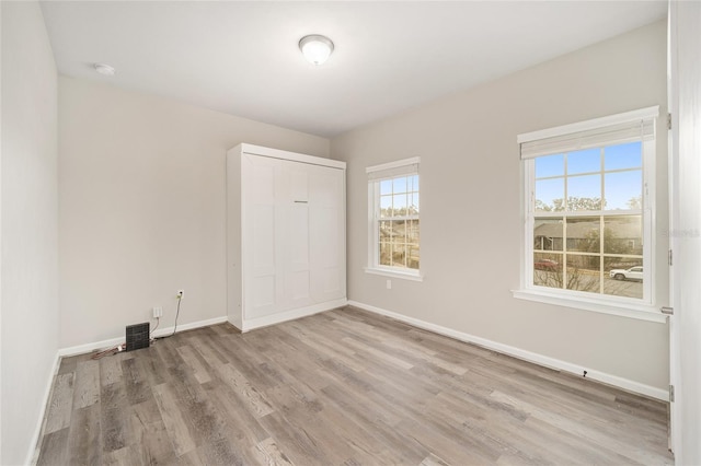 unfurnished room featuring light hardwood / wood-style floors