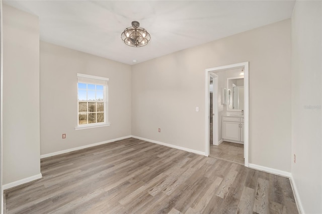 unfurnished room featuring light wood-type flooring