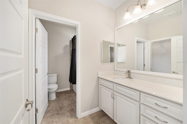 bathroom with vanity and toilet