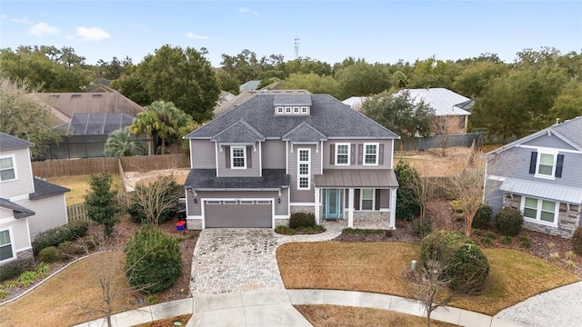 view of front of home with a garage and a front yard