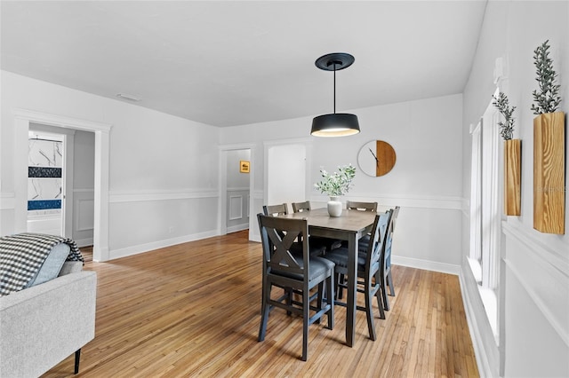 dining area featuring light wood-type flooring