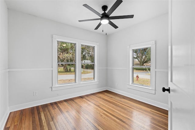 unfurnished room featuring hardwood / wood-style floors and ceiling fan