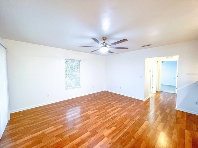 unfurnished room featuring ceiling fan and light hardwood / wood-style flooring