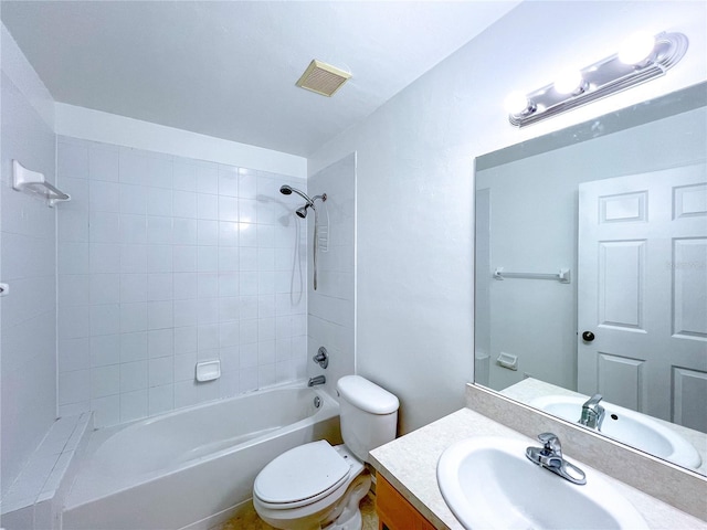 full bathroom featuring toilet, vanity, and tiled shower / bath