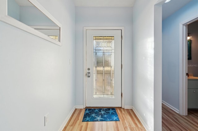 doorway with wood-type flooring