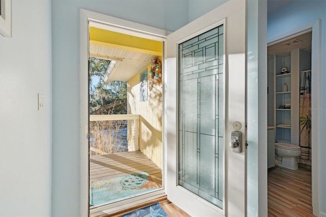 entryway with hardwood / wood-style flooring