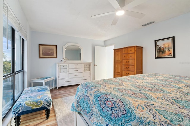 bedroom featuring ceiling fan and wood-type flooring