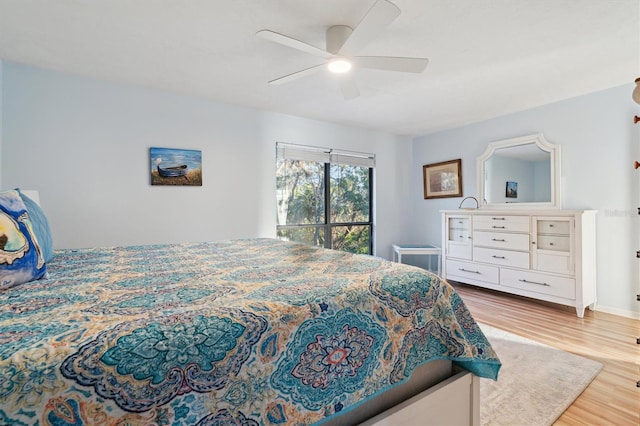 bedroom featuring ceiling fan and light hardwood / wood-style flooring