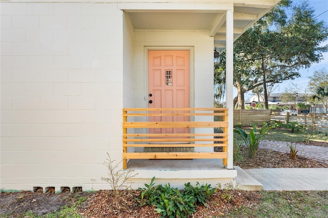 entrance to property with concrete block siding