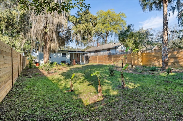 view of yard featuring a fenced backyard