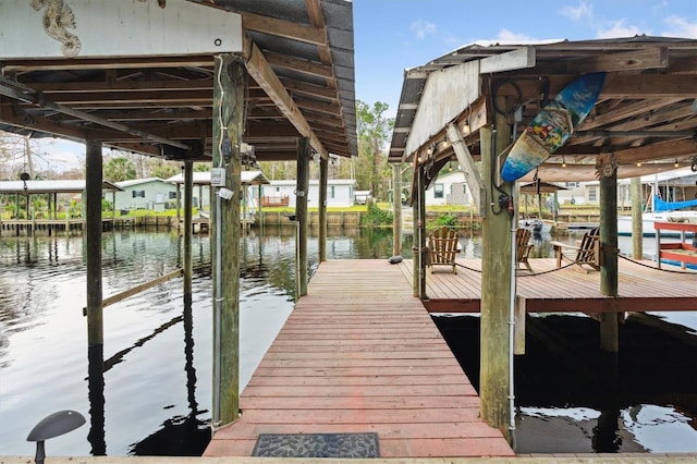 dock area with a water view