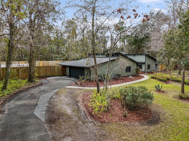 view of front facade featuring a front lawn and a garage