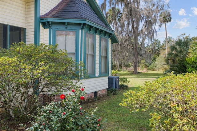 view of property exterior with a yard