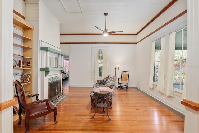 sitting room with ceiling fan and light hardwood / wood-style floors